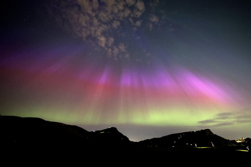 The aurora borealis, also known as the northern lights, above Arthur’s Seat and Salisbury Crags in Holyrood Park