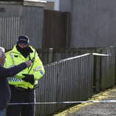 The scene in Tinto View where police shot a large bulldog type of dog after it attacked a man on January 24 (Photo by Jeff J Mitchell/Getty Images)