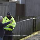 The scene in Tinto View where police shot a large bulldog type of dog after it attacked a man on January 24 (Photo by Jeff J Mitchell/Getty Images)