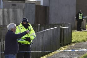 The scene in Tinto View where police shot a large bulldog type of dog after it attacked a man on January 24 (Photo by Jeff J Mitchell/Getty Images)
