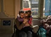 A Ukrainian evacuee hugs a child at the train station in Przemysl, near the Polish-Ukrainian border (Picture: Angelos Tzortzinis/AFP via Getty Images)
