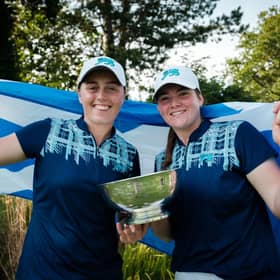 Broomieknowe's Hannah Darling, left, and Milngavie member Lorna McClymont show off the trophy after helping Great Britain & Ireland winthe 43rd Curtis Cup at Sunningdale. Picture: Chris Young/Scottish Golf