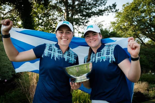 Broomieknowe's Hannah Darling, left, and Milngavie member Lorna McClymont show off the trophy after helping Great Britain & Ireland winthe 43rd Curtis Cup at Sunningdale. Picture: Chris Young/Scottish Golf