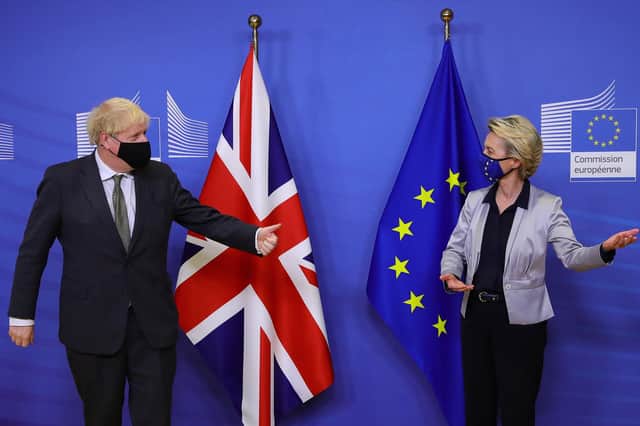 Boris Johnson is welcomed by EC President Ursula von der Leyen in the Berlaymont building at the EU headquarters in Brussels on December 9