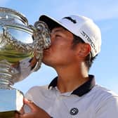 Ryo Hisatsune of Japan celebrates with the trophy after winning the Cazoo Open de France at Le Golf National.