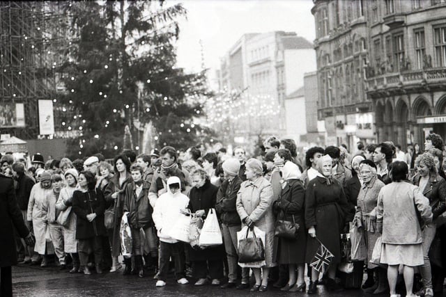 Crowds wait to see the Queen on a visit to Sheffield in December 1986