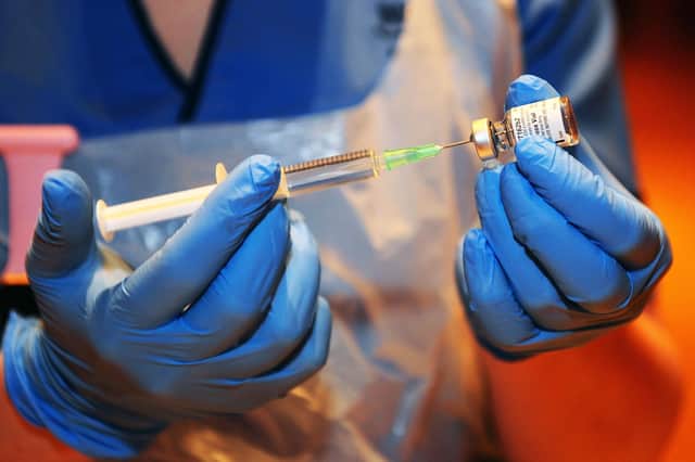 A nurse prepares a dose of Covid-19 vaccine (Picture: Michael Gillen)