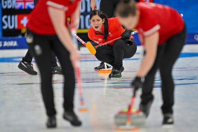 Team GB's Eve Muirhead delivers a stone at the 2022 Winter Olympics in Beijing.