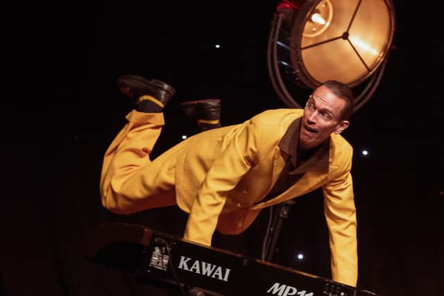 "The Professor Vince Hurley" flies as he plays the piano.