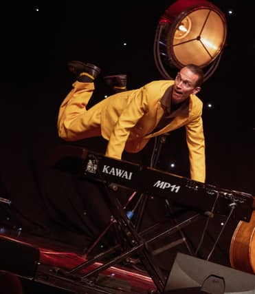 "The Professor Vince Hurley" flies as he plays the piano.