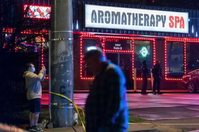 Law enforcement personnel utside a massage parlour where a person was shot and killed in Atlanta, Georgia on 16 March 2021 (Photo: ELIJAH NOUVELAGE/AFP via Getty Images)