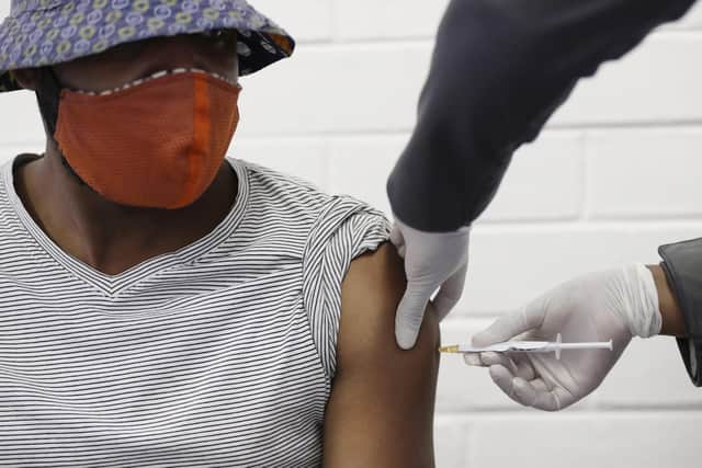 A volunteer receives a Covid-19 test vaccine developed at the University of Oxford at a hospital in Soweto, South Africa. (Picture: Siphiwe Sibeko/AP)