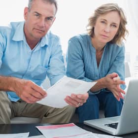 Middle-income households will face a hit to their personal disposable income ranging from 7 per cent to 13 per cent, according to the report. Picture: Getty Images/iStockphoto.