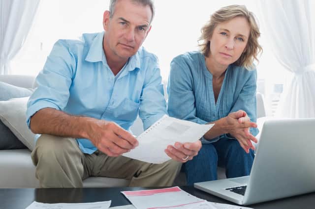 Middle-income households will face a hit to their personal disposable income ranging from 7 per cent to 13 per cent, according to the report. Picture: Getty Images/iStockphoto.