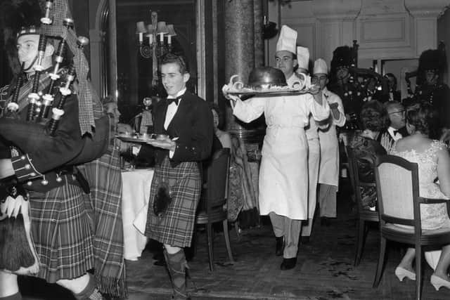 1st December 1959:  Piping in the haggis in the restaurant at the Savoy Hotel, London. Image: Evening Standard/Getty Images