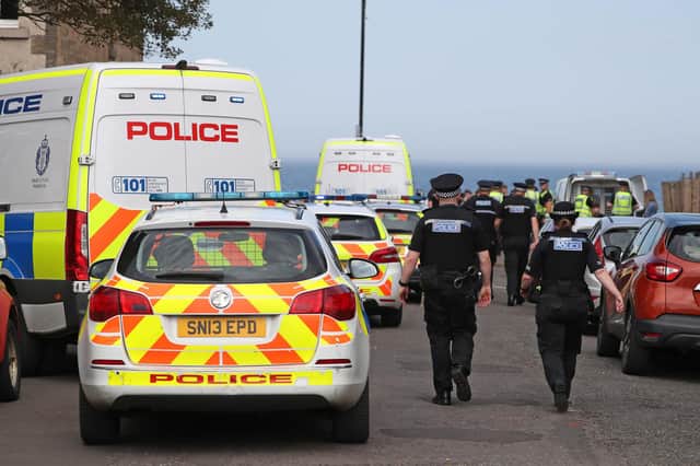 Police at Portobello Beach in Edinburgh where they broke up large crowds who flocked to the beach to make the most of the good weather.