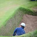 South African Haydn Porteous escapes from a deep bunker at Royal Troon during the 2016 Open. Picture: Andy Buchanan/AFP via Getty Images.