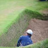South African Haydn Porteous escapes from a deep bunker at Royal Troon during the 2016 Open. Picture: Andy Buchanan/AFP via Getty Images.
