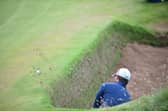 South African Haydn Porteous escapes from a deep bunker at Royal Troon during the 2016 Open. Picture: Andy Buchanan/AFP via Getty Images.