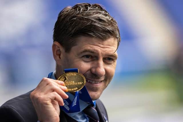 Rangers manager Steven Gerrard with his Premiership winners' medal during the celebrations after their 4-0 win over Aberdeen at Ibrox. (Photo by Craig Williamson / SNS Group)