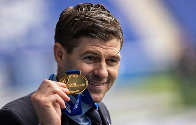 Rangers manager Steven Gerrard with his Premiership winners' medal during the celebrations after their 4-0 win over Aberdeen at Ibrox. (Photo by Craig Williamson / SNS Group)