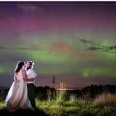 Rebecca MacDonald and Chris Oram pictured under the Northern Lights which appeared during their wedding on Monday. PIC: Michael Carver Photography.