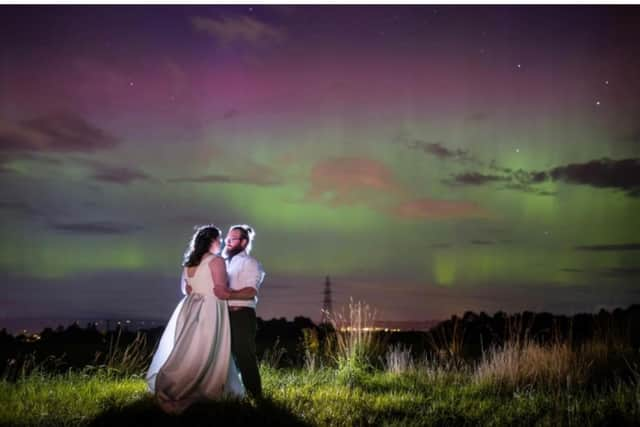 Rebecca MacDonald and Chris Oram pictured under the Northern Lights which appeared during their wedding on Monday. PIC: Michael Carver Photography.