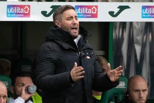 Hibs manager Lee Johnson offers advice from the touchline.