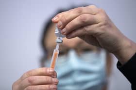 Nurse Sarah MacLeod, from the Vaccination Team, prepares a vaccine at the coronavirus mass vaccine centre at the Edinburgh International Conference Centre. Picture date: Monday February 1, 2021.