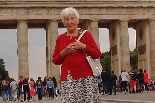 Teresa Vass in front of the Brandenburg Gate in Berlin