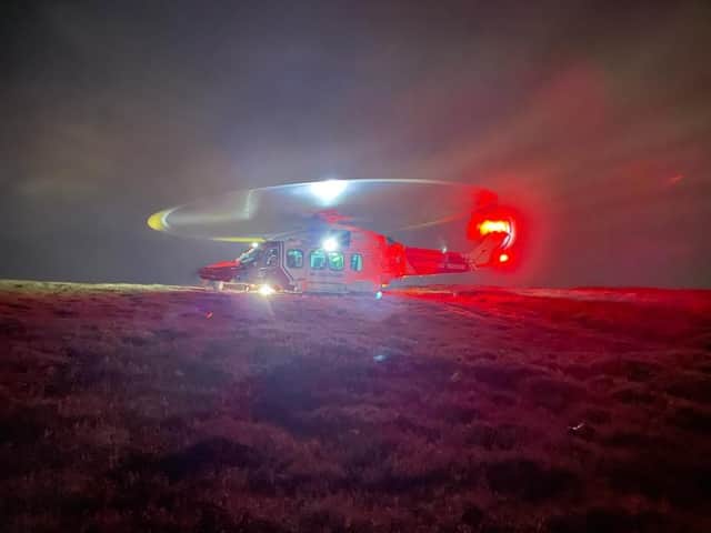 Coastguard helicopter arrives at Tinto Hill to assist with a rescue after a woman fell and suffered an injury picture: Moffat Mountain Rescue Team