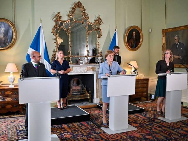 Nicola Sturgeon flanked by Scottish Greens co-leaders Patrick Harvie and Lorna Slater (Picture: Jeff J Mitchell /Pool /AFP/Getty)