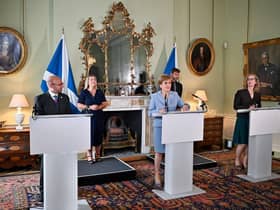 Nicola Sturgeon flanked by Scottish Greens co-leaders Patrick Harvie and Lorna Slater (Picture: Jeff J Mitchell /Pool /AFP/Getty)