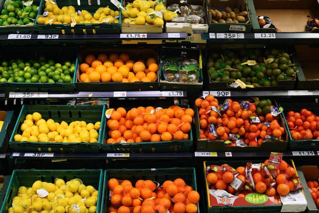 A view of limes, lemons, oranges, kiwis and tangerines in a Tesco in London.