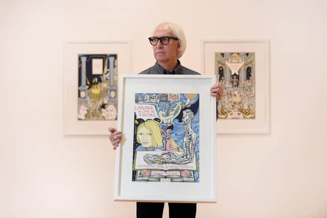 John Mackechnie MBE, Director of Glasgow Print Studio, with the work of artist, Alasdair Gray at the Omnium Gatherum exhibition PIC: John Devlin