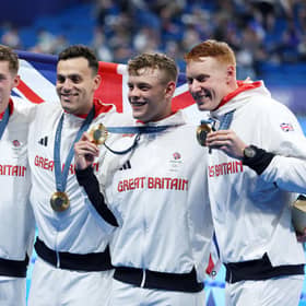 Duncan Scott, James Guy, Tom Dean, Matthew Richards of Great Britain pose following the medal ceremony after the men’s 4x200m freestyle relay final (Photo by Sarah Stier/Getty Images)