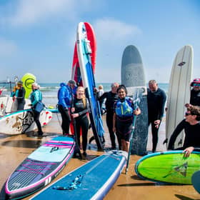 A group of surfers, paddleboarders, and wild swimmers protesting about water quality at Scarborough. This weekend thousands will take to coasts and rivers across the UK to protest about the state of the nation's waterways. PIC: James Hardisty