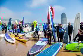 A group of surfers, paddleboarders, and wild swimmers protesting about water quality at Scarborough. This weekend thousands will take to coasts and rivers across the UK to protest about the state of the nation's waterways. PIC: James Hardisty
