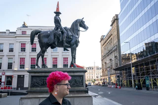 Gallery steward Louisa Mcgeachie, stands by the Duke of Wellington statue, which now wears a traffic cone, consider by many to be the first original piece of 'street art' outside Glasgow's GoMA where the new show by street artist Banksy 'Cut & Run' opens this Sunday, revealing for the first time the stencils used to create many of the artist's most iconic works. The show includes authentic artefacts, ephemera and the artist's actual toilet and will run for three months and open all night at weekends. Picture date: Thursday June 15, 2023. PA Photo. See PA story ARTS Banksy. Photo credit should read: Jane Barlow/PA Wire