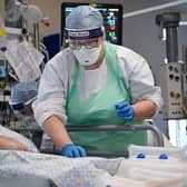 A member of staff at University Hospital Monklands tends to a Covid-positive patient in the intensive care unit earlier this month (Picture: Jeff J Mitchell/Getty Images)