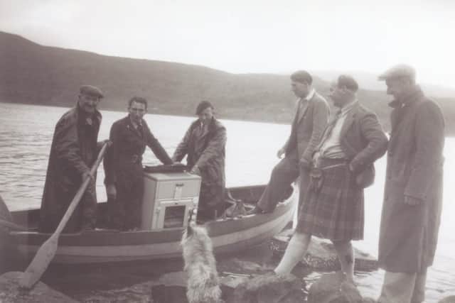 A rowing boat is commandeered to deliver a new cooker as electricity is switched on across the Highlands and Islands. PIC: Bill Ramsay Collection/Skye and Lochalsh Archive Centre/Am Baile.