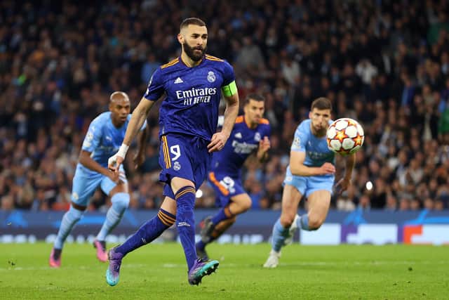 Karim Benzema chips home a Panenka penalty to score Real Madrid's third goal in the Champions League semi-final first leg 4-3 defeat to Manchester City at the Etihad. (Photo by Catherine Ivill/Getty Images)