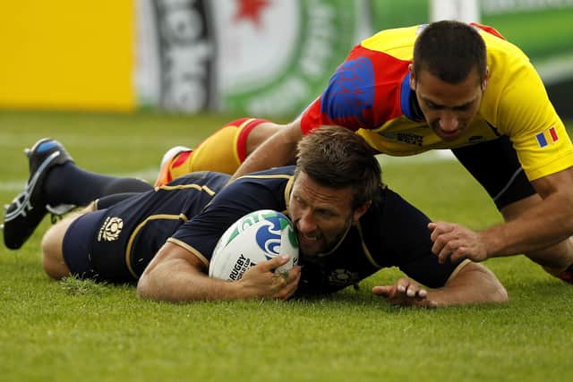 Simon Danielli of Scotland scores a try in the narrow win over Romania.