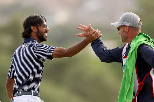 Akshay Bhatia  celebrates with his caddie after winning the Valero Texas Open in a play-off at TPC San Antonio. Picture: Brennan Asplen/Getty Images.