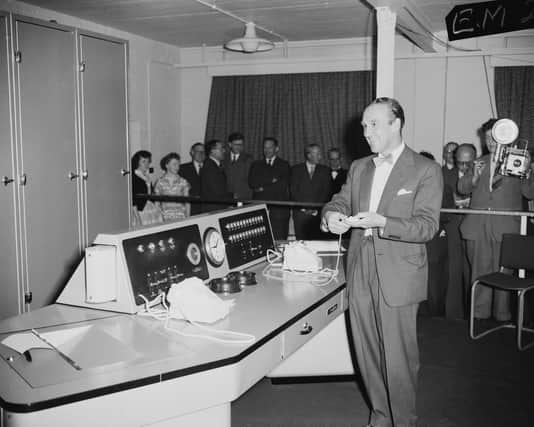 Postmaster General Ernest Marples presses the button of 'Ernie' to generate the winning number in the first premium bond savings draw in June 1957 (Picture: Edward MiIlerKeystone/Hulton Archive/Getty Images)