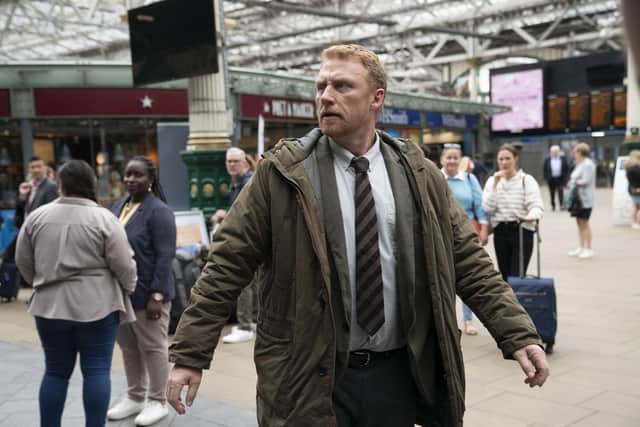 Kevin McKidd filming in Edinburgh's Waverley Station in summer, 2022 for Six Four, ITVX's new crime drama. Pic: ITV Plc