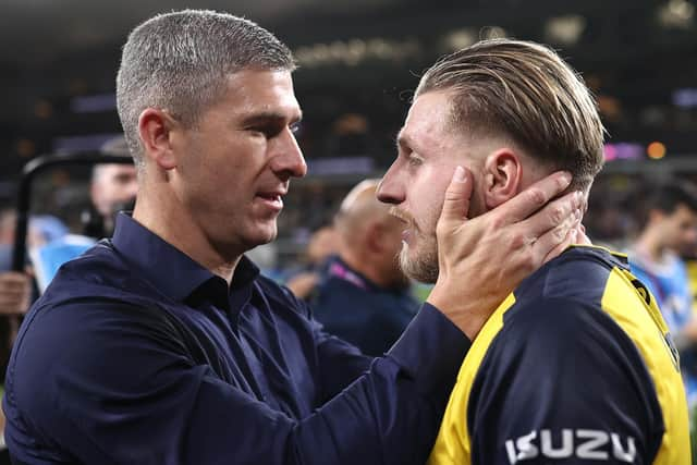 Mariners head coach Nick Montgomery celebrates with Jason Cummings after winning the 2023 A-League Men's Grand Final. (Photo by Cameron Spencer/Getty Images)