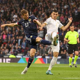 GLASGOW, SCOTLAND - JUNE 08: Stuart Armstrong of Scotland shoots as Eduard Spertsyan of Armenia tries to block during the UEFA Nations League League B Group 1 match between Scotland and Armenia at Hampden Park National Stadium on June 08, 2022 in Glasgow, Scotland. (Photo by Ian MacNicol/Getty Images)