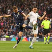 GLASGOW, SCOTLAND - JUNE 08: Stuart Armstrong of Scotland shoots as Eduard Spertsyan of Armenia tries to block during the UEFA Nations League League B Group 1 match between Scotland and Armenia at Hampden Park National Stadium on June 08, 2022 in Glasgow, Scotland. (Photo by Ian MacNicol/Getty Images)