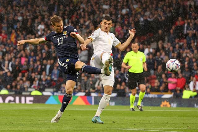 GLASGOW, SCOTLAND - JUNE 08: Stuart Armstrong of Scotland shoots as Eduard Spertsyan of Armenia tries to block during the UEFA Nations League League B Group 1 match between Scotland and Armenia at Hampden Park National Stadium on June 08, 2022 in Glasgow, Scotland. (Photo by Ian MacNicol/Getty Images)
